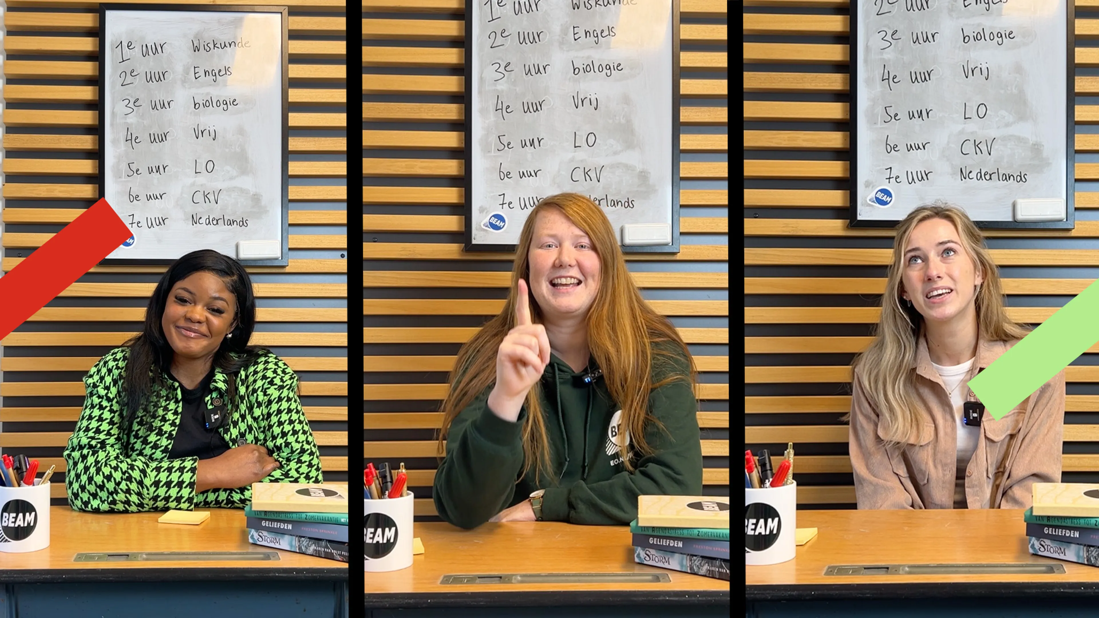 De BEAM redacteuren Wilke, Daniëlle en Merveille zitten achter een schooltafeltje.